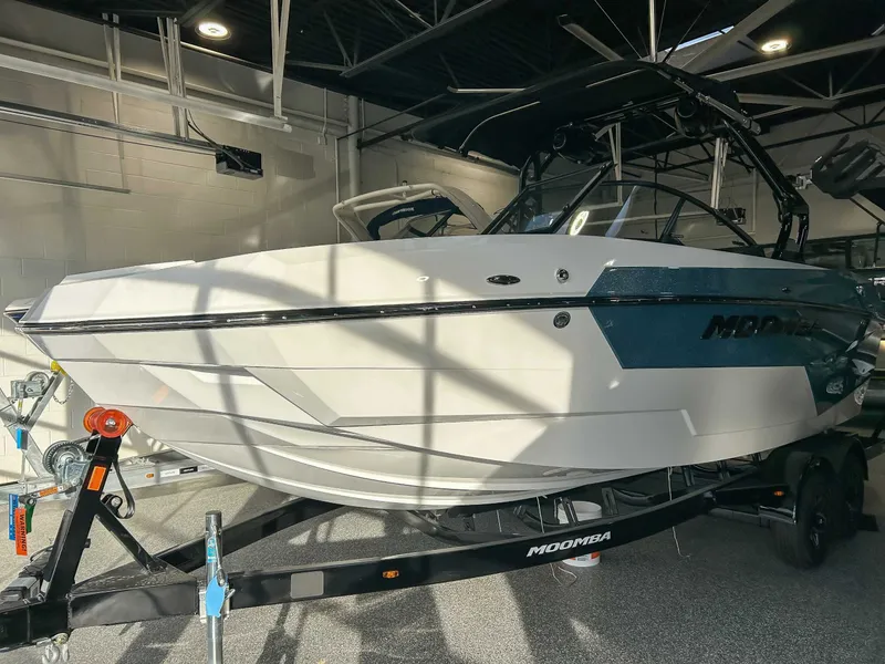 Slide: The Image of 2025 Moomba Max boat in showroom on trailer. - 3