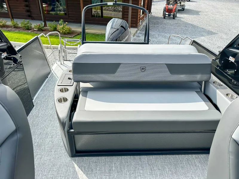 Slide: The Image of 2025 Premier 230 Solaris RL boat with gray seating and cup holders. - 14