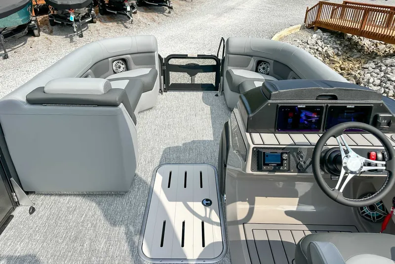 Slide: The Image of Interior of 2025 Premier 230 Solaris RL with gray seating and helm console. - 16