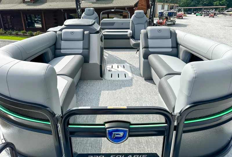 Slide: The Image of Interior of 2025 Premier 230 Solaris RL with gray leather seating. - 18