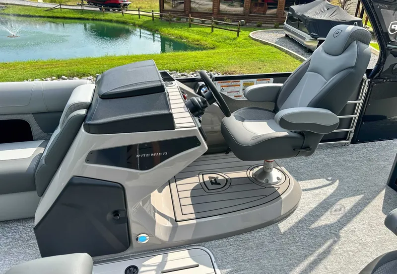 Slide: The Image of Interior of 2025 Premier 230 Solaris RL with luxurious captain's chair. - 22