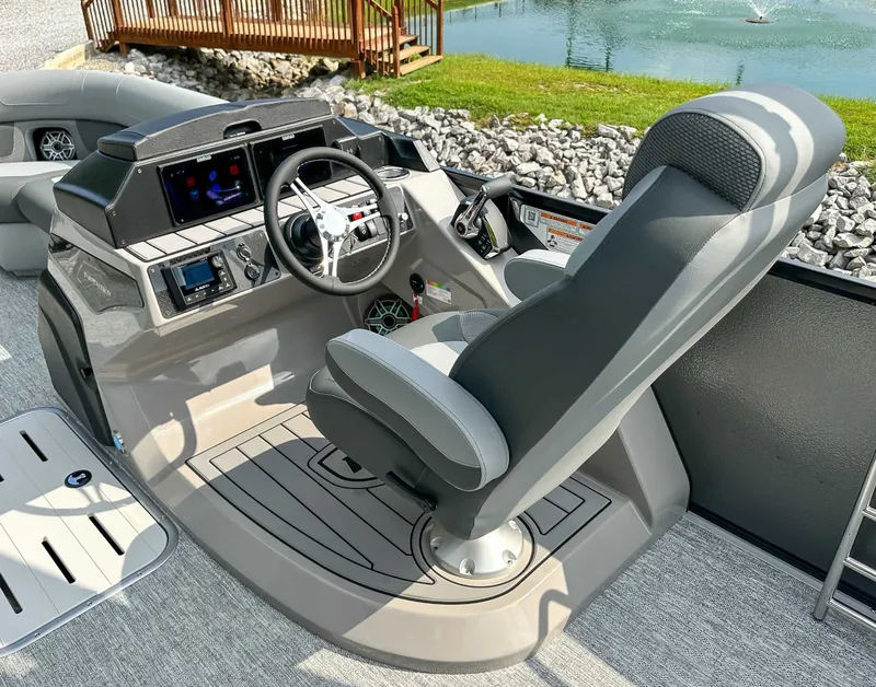 Slide: The Image of Driver's seat and controls of the 2025 Premier 230 Solaris RL boat. - 23