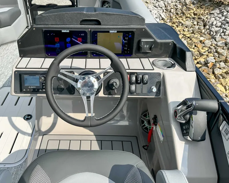 Slide: The Image of Premier 230 Solaris RL 2025 helm with Simrad displays. - 25
