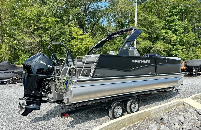 Slide: The Image of 2025 Premier 230 Solaris RL pontoon boat on trailer outdoors. - 7