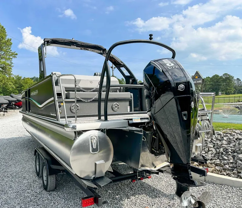 Slide: The Image of 2025 Premier 230 Solaris RL pontoon boat with outboard motor. - 9