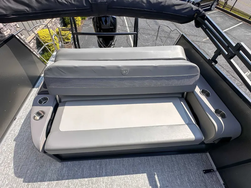 Slide: The Image of 2025 Premier 230 Sunsation RL boat with gray seating area. - 13