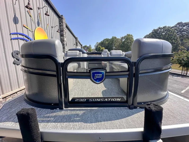 Slide: The Image of 2025 Premier 230 Sunsation RL pontoon boat outdoors. - 4