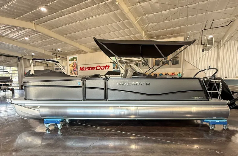 The Image of 2025 Premier 250 Sunsation RL pontoon boat in a showroom. - 1