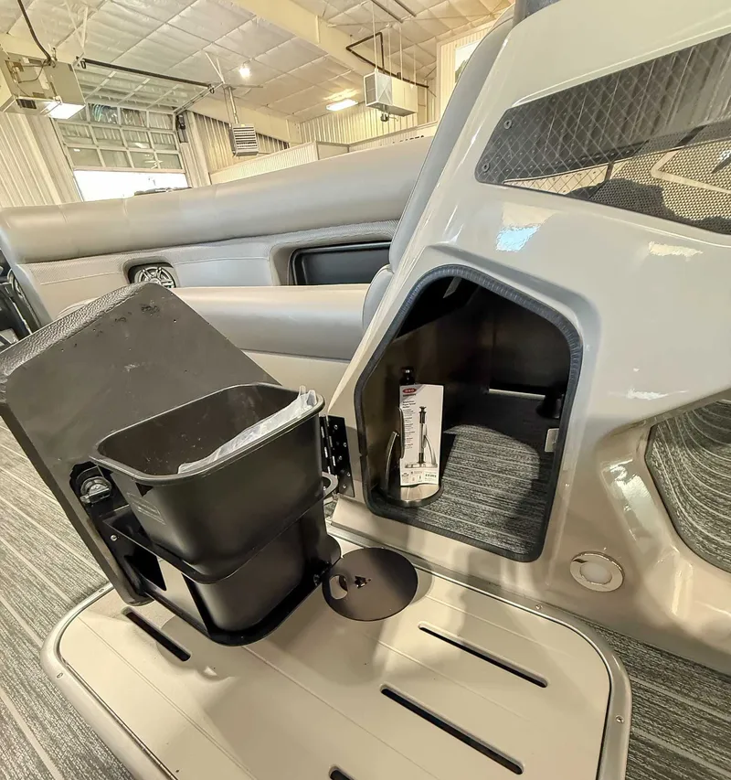 Slide: The Image of Interior of 2025 Premier 250 Sunsation RL (PTX 28) with storage and trash bin. - 16