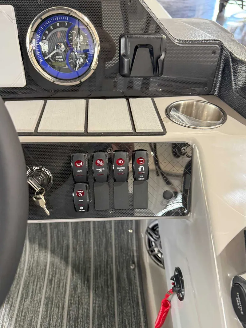 Slide: The Image of Dashboard of 2025 Premier 250 Sunsation RL with switches and gauge. - 21