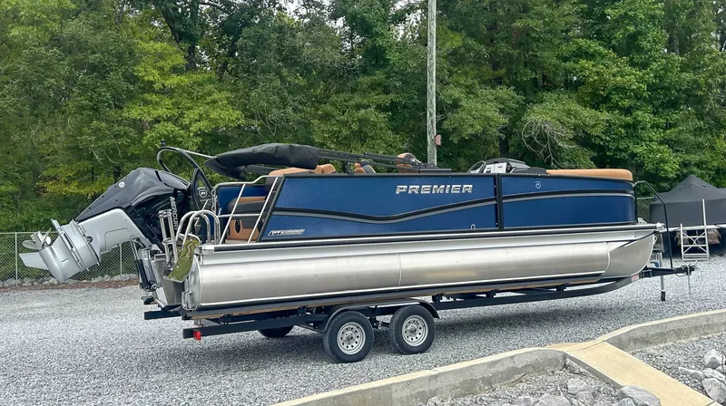 Slide: The Image of 2026 Premier Solaris 230 RL pontoon boat on trailer outdoors. - 7
