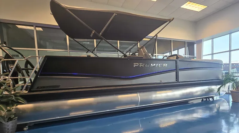 Slide: The Image of 2026 Premier Solaris 250 RL pontoon boat in showroom. - 3