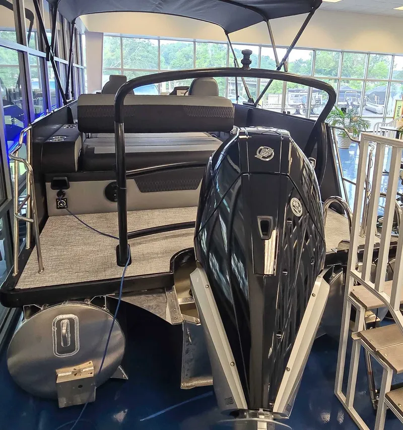 Slide: The Image of 2026 Premier Solaris 250 RL boat with motor in showroom. - 5