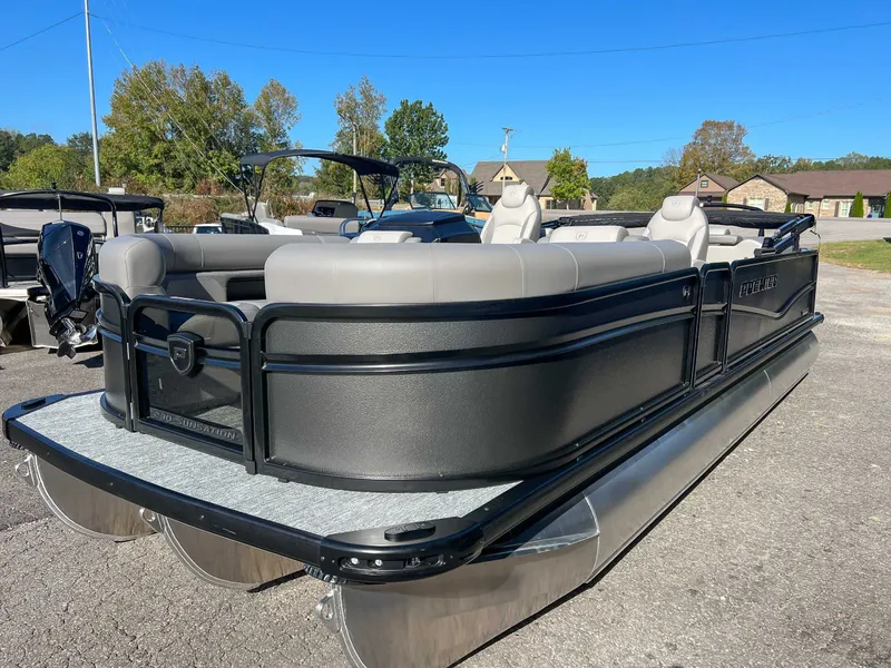 Slide: The Image of 2026 Premier Sunsation 230 RF pontoon boat in parking lot. - 3