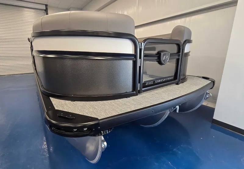 Slide: The Image of 2026 Premier Sunsation 230 RL pontoon boat in a showroom. - 3