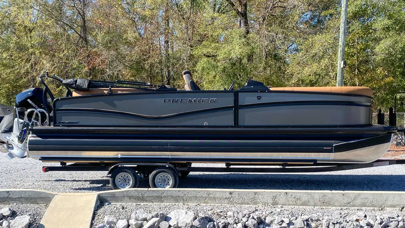 The Image of 2026 Premier Solaris 250 RF pontoon boat on trailer. - 1