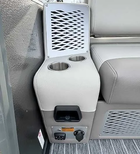 Slide: The Image of Interior of 2026 Premier Intrigue 230 RL with cup holders and outlets. - 13