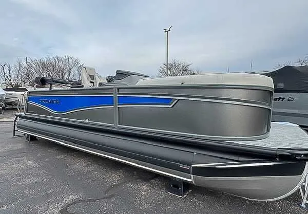 Slide: The Image of 2026 Premier Intrigue 230 RL pontoon boat in parking lot. - 3