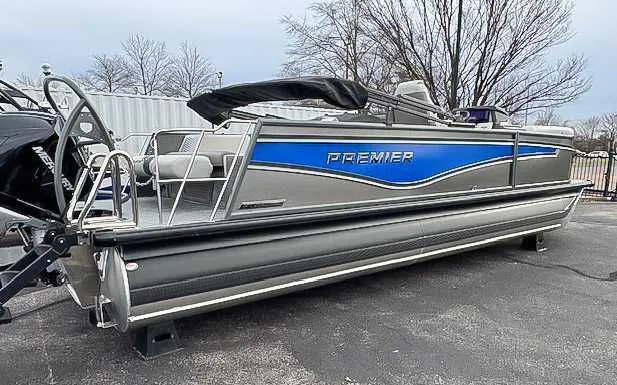 Slide: The Image of 2026 Premier Intrigue 230 RL pontoon boat on parking lot. - 5