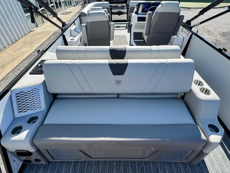 Slide: The Image of Interior of 2026 Premier Intrigue 230 RL with gray leather seating. - 10