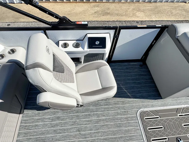 Slide: The Image of Interior of 2026 Premier Intrigue 230 RL with gray seating and flooring. - 16