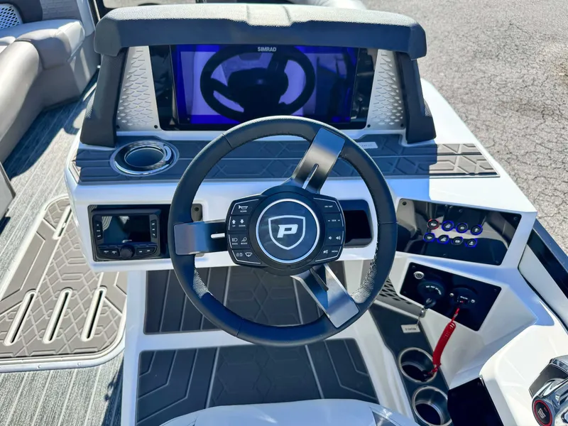 Slide: The Image of Steering wheel of 2026 Premier Intrigue 230 RL with modern control console. - 19