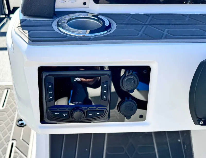 Slide: The Image of 2026 Premier Intrigue 230 RL console with controls and cup holder. - 21