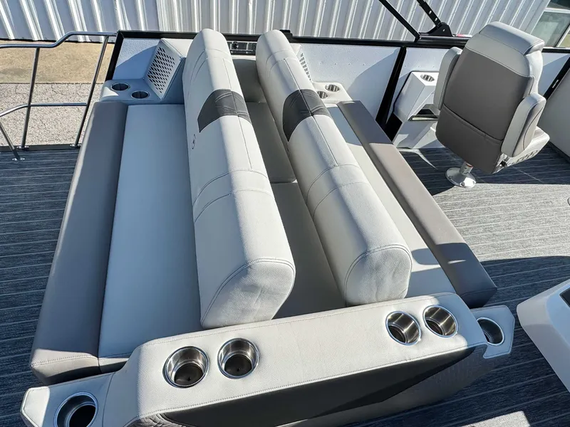 Slide: The Image of Interior of 2026 Premier Intrigue 230 RL with gray seating and cup holders. - 23