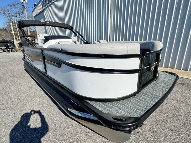 Slide: The Image of 2026 Premier Intrigue 230 RL pontoon boat, side view. - 3