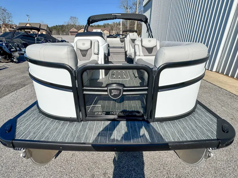 Slide: The Image of 2026 Premier Intrigue 230 RL pontoon boat on parking lot. - 4