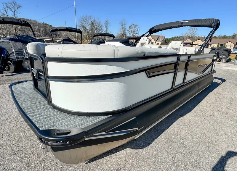 Slide: The Image of 2026 Premier Intrigue 230 RL pontoon boat on parking lot. - 5