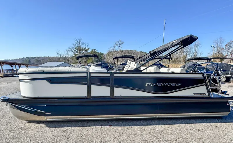 Slide: The Image of 2026 Premier Intrigue 230 RL pontoon boat on parking lot. - 6