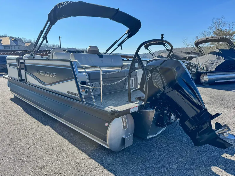 Slide: The Image of 2026 Premier Intrigue 230 RL pontoon boat on parking lot. - 7