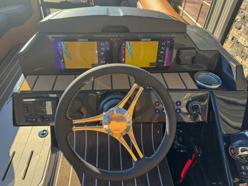 Slide: The Image of 2026 Premier Solaris 230 RF dashboard with Simrad displays. - 16