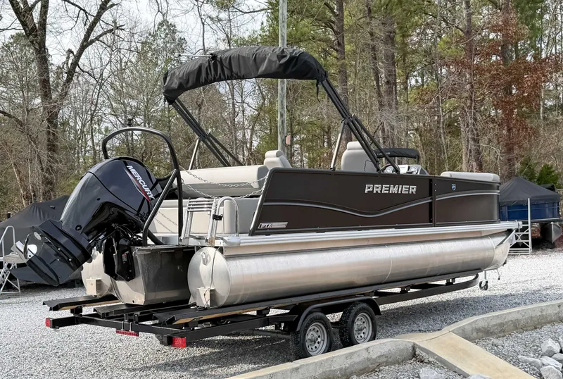 Slide: The Image of 2026 Premier Sunscape 220 RL pontoon boat on trailer outdoors. - 7