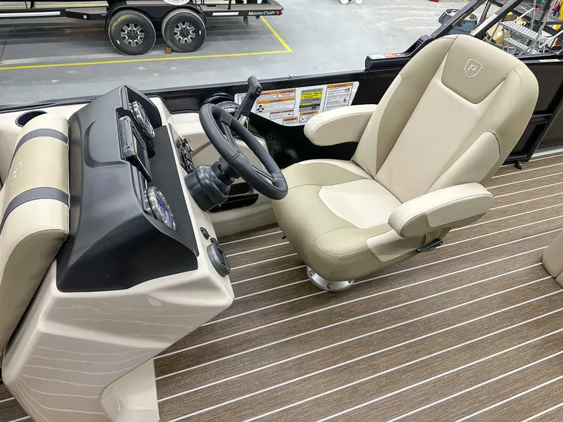 Slide: The Image of Interior of Premier Sunscape 220 RL (25 PTX) 2026 with steering wheel and seat. - 13