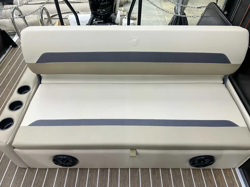 Slide: The Image of Premier Sunscape 220 RL 2026 boat seat with speakers and cup holders. - 15