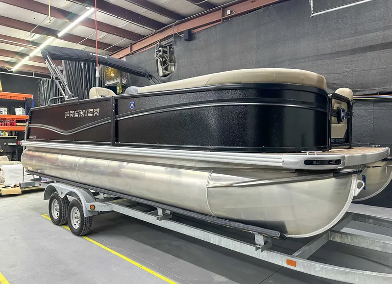 Slide: The Image of 2026 Premier Sunscape 220 RL pontoon boat in warehouse. - 3