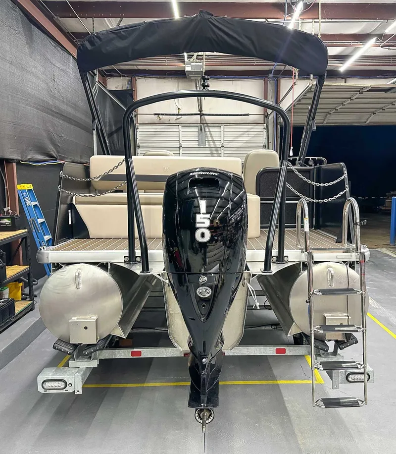Slide: The Image of 2026 Premier Sunscape 220 RL pontoon boat in warehouse. - 6