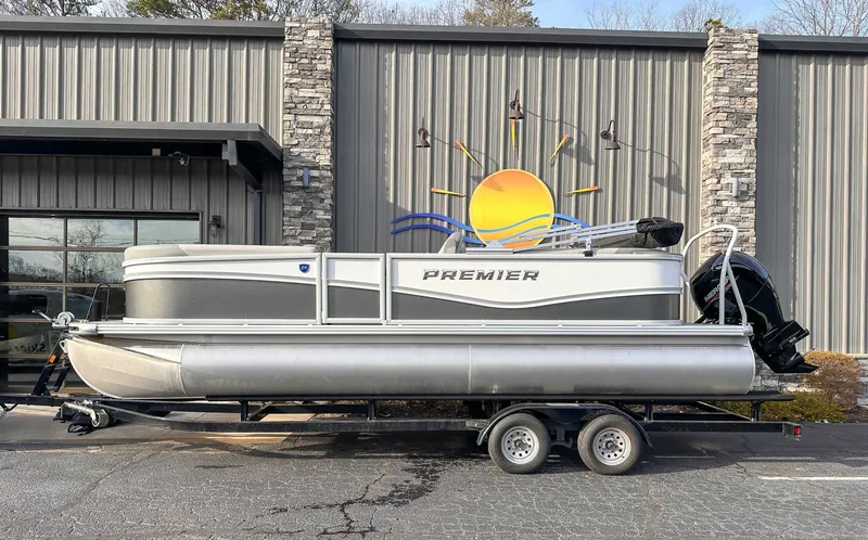 The Image of 2026 Premier Sunscape 220 RF pontoon boat in front of building. - 1