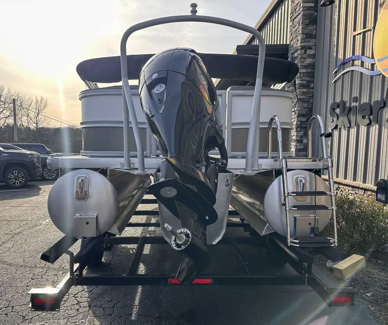 Slide: The Image of Rear view of a 2026 Premier Sunscape 220 RF pontoon boat on a trailer. - 7
