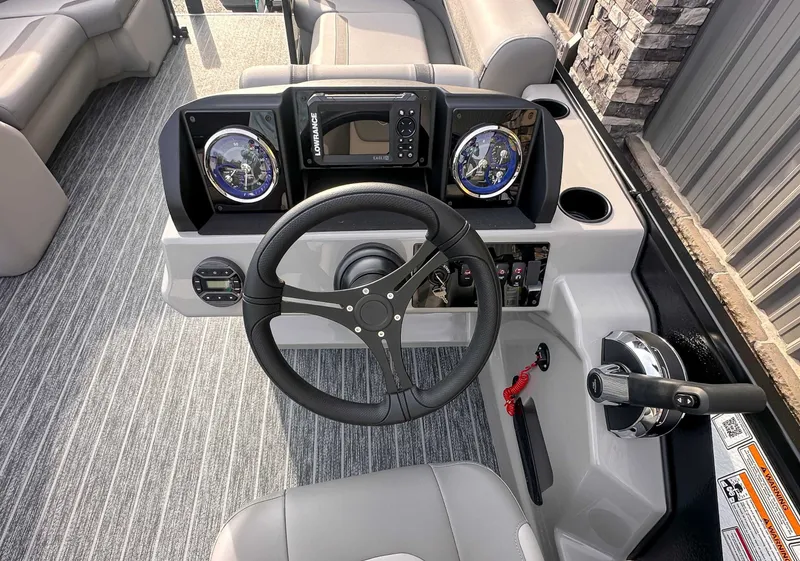 Slide: The Image of 2026 Premier Sunscape 220 RL helm with modern instruments. - 13