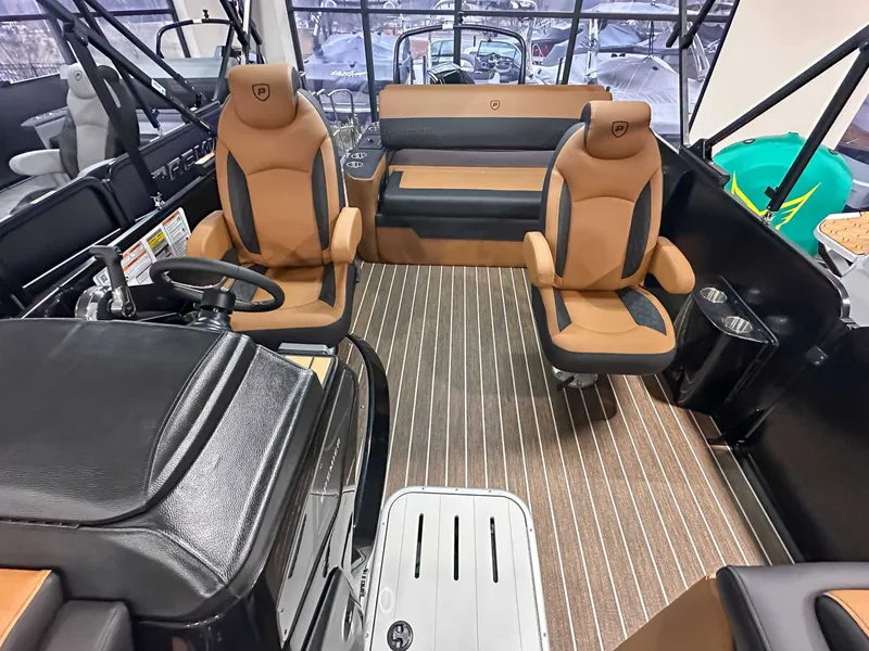 Slide: The Image of Interior of 2026 Premier Sunsation 230 RL with luxurious seating. - 11