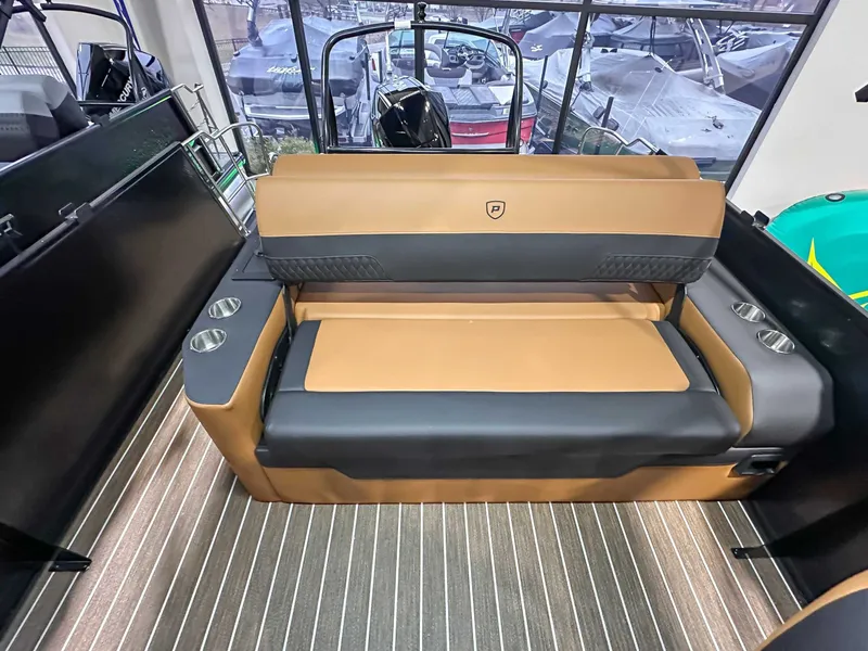Slide: The Image of Interior of 2026 Premier Sunsation 230 RL with beige and black seating. - 15