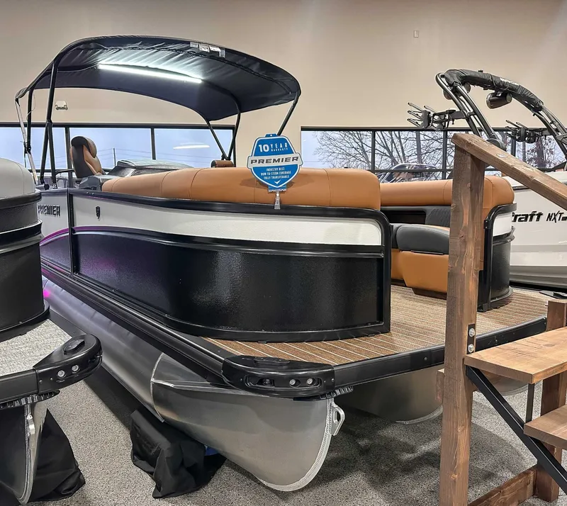 Slide: The Image of 2026 Premier Sunsation 230 RL pontoon boat in showroom. - 4