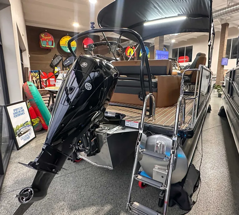 Slide: The Image of 2026 Premier Sunsation 230 RL pontoon boat in showroom. - 5