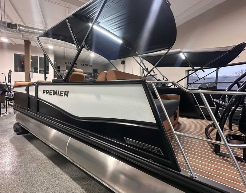 Slide: The Image of 2026 Premier Sunsation 230 RL pontoon boat in showroom. - 6