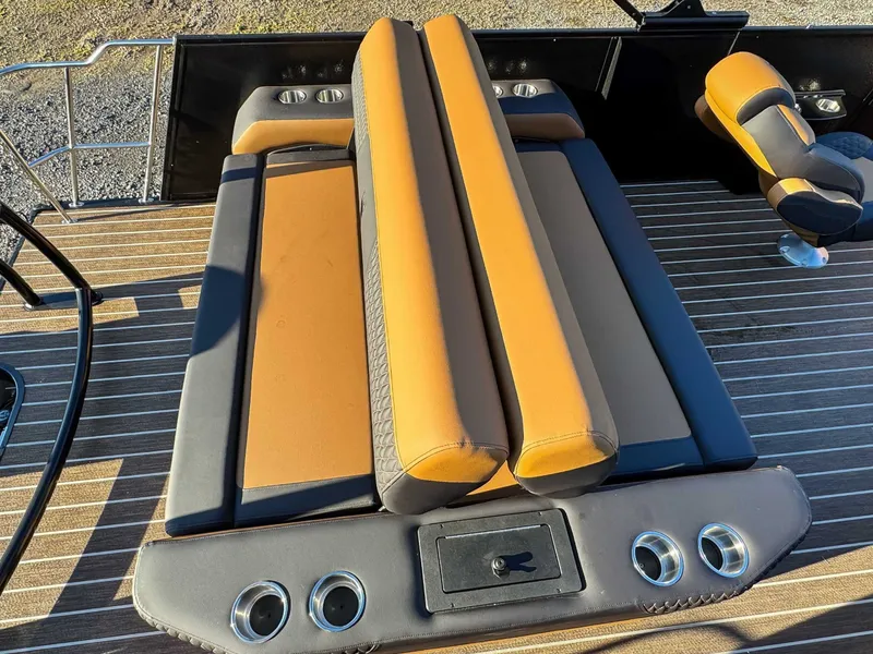Slide: The Image of Premier Solaris 250 RL 2026 boat seating with cup holders. - 19