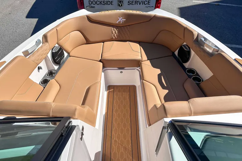 Slide: The Image of Interior of 2026 MasterCraft XT24 with beige leather seating. - 15
