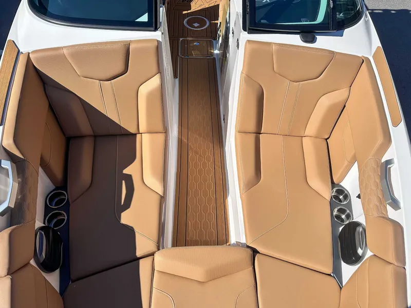 Slide: The Image of Interior of 2026 MasterCraft XT24 with beige leather seating. - 16
